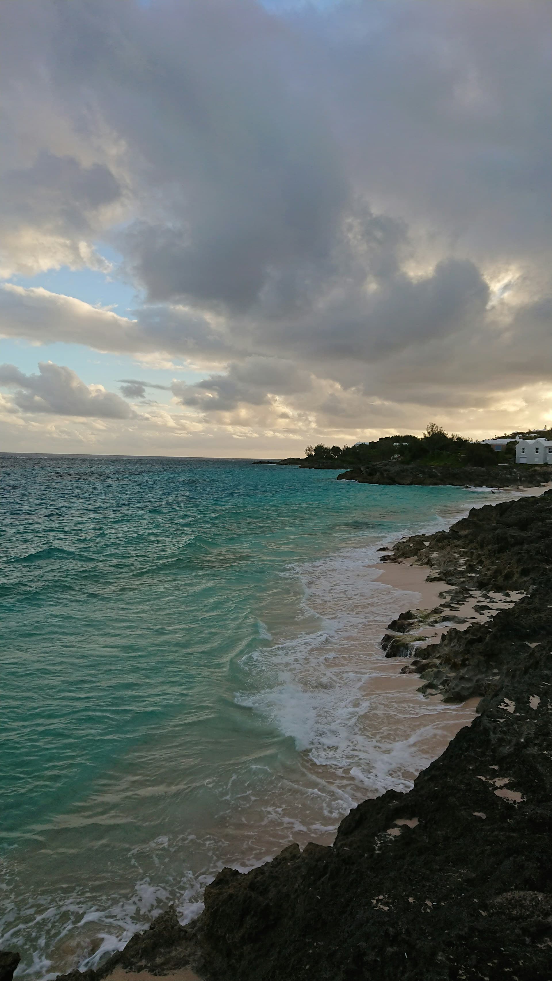 Rocky cove and turquoise water at Pink Beach, Bermuda