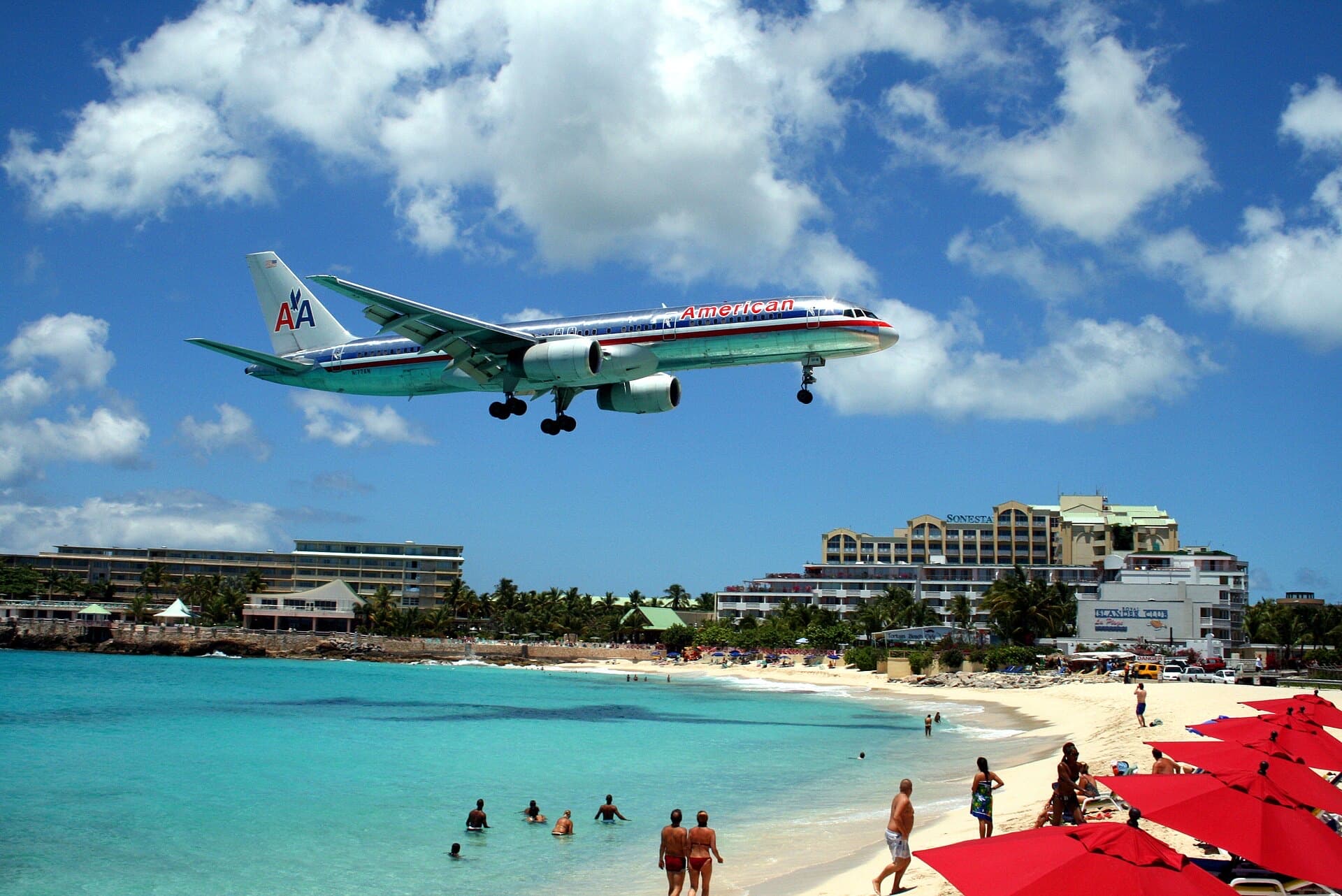 An American Airlines jet on final approach over Maho Beach, Sint Maarten